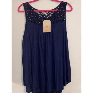 Sleeveless navy top with lace